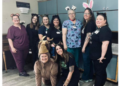 caregivers and residents dressed up for halloween at Golden Good Shepherd